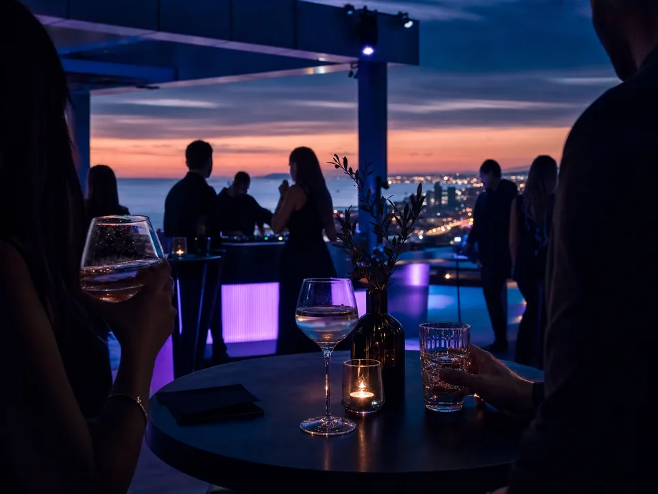 Lounge area at an evening music event with blue and violet lights